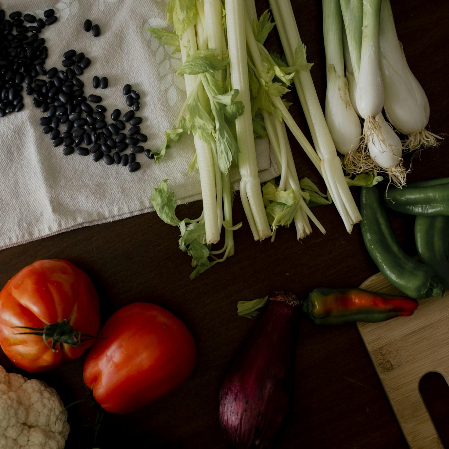 Members collaborating in a modern kitchen, sharing recipes and techniques
